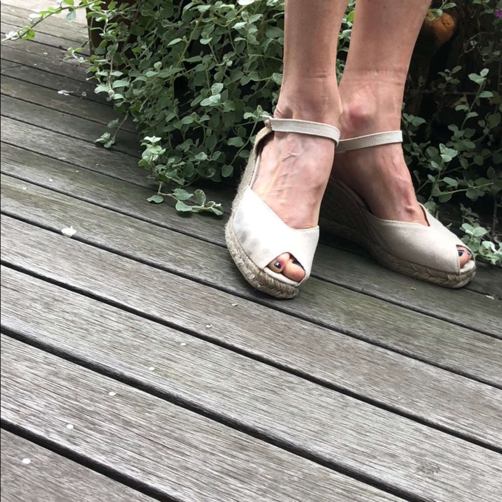 Tan espradrille wedges.